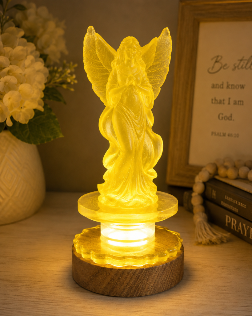 Yellow resin angel night light on dimmable USB LED base, also available in white